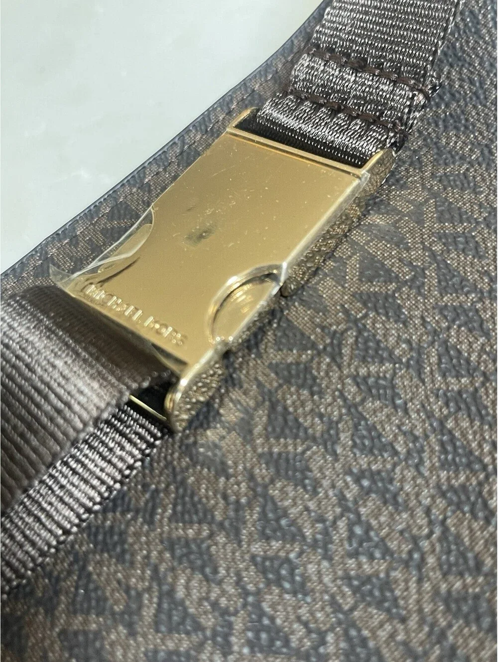 Michael Kors Logo Double-Zip Fanny Pack in brown with gold-tone hardware